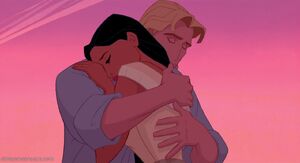 Pocahontas and Smith embrace.