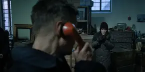 Joyce telling Antonov what phone numbers they need to get in touch with.