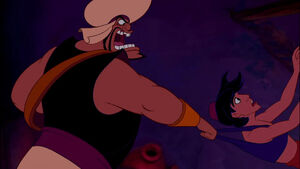 Aladdin being grabbed by Razoul again.