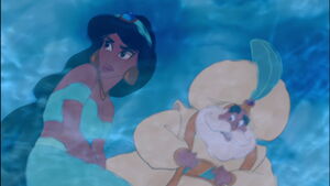 Jasmine and the Sultan's reflections in the water.