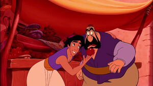 Aladdin giving an apple to the vendor, in order to appease him.