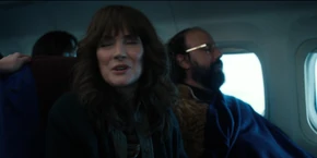 Joyce telling the stewardess she and Murray are "visiting" an old friend.