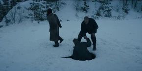 Joyce as Hopper helps Antonov out of the sewer.