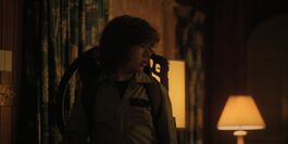 Dustin entering his home, taking the strange creature with him.