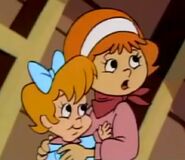 Daphne holding Shaggy's baby sister Sugie