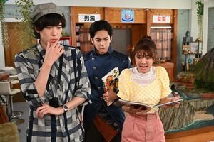 Touma, Rintaro and Mei examining books.