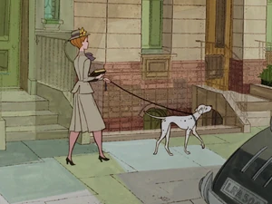 Perdita and her owner, Anita walking together.