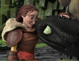 Valka tending to Toothless