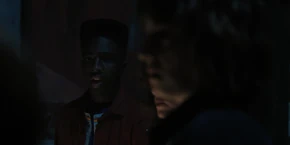 Lucas telling Max to put on her headphones.