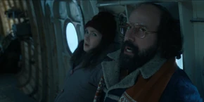 Joyce and Murray watching Yuri start flying the plane.