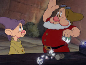 Doc having knocked the diamonds out of Dopey's eyes, annoyed with his goofiness.