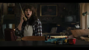 Joyce calling Murray on the phone, telling him about the doll she just received in the mail.