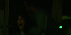 An agonized Joyce being dragged out of the lab as she watches Bob die in front of her.