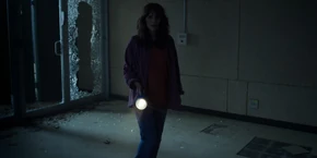 Joyce in the empty, abandoned lab.