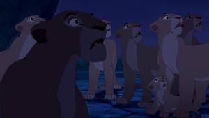 Sarafina and the pride watch as hyenas invade Pride Rock.