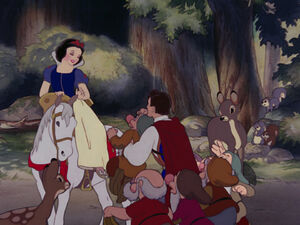 The Prince going to help the dwarves say goodbye to Snow White.