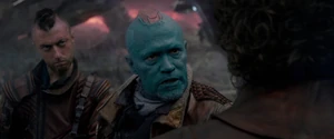Kraglin watching Yondu threaten the Ravager with his Yaka Arrow.
