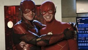 Behind the scenes shot of Ezra Miller with Grant Gustin.