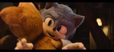 Tails hugs Sonic after he accepts him as his friend.