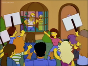 Homer Simpson being ranted by an angry mob of Springfieldian college students who attended Springfield College.