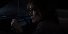 Joyce watching her lights flicker and hearing "Should I Stay or Should I Go" play on the radio.