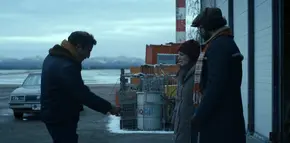 Joyce and Murray watching the man demonstrate how Yuri was "killed" by polar bears.