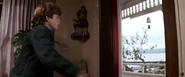 Mikey going to open the door for Data, only to forget to open the screen door.