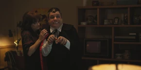 Joyce watching Bob going to greet some trick-or-treaters.