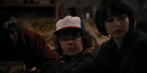 Lucas, Dustin, and Mike hearing El answer Hopper's questions on where the gate is located within the lab.