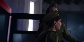 Joyce getting out of the cart after Murray and Hopper bypass a guard.