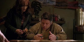 Joyce being told by Bob the ration is one-to-one.