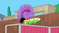 Phineas and Holly squirt water guns at the gelatin monster.