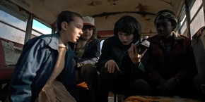 The kids hearing Nancy's voice through the walkie.