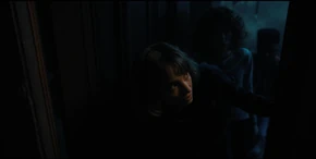 Lucas, Nancy, and Robin seeing a light flickering in an attic, realizing Vecna has gone up there.