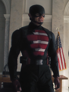 Wyatt Russell as John Walker, wearing the U.S. Agent uniform.