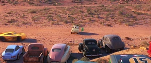 Smokey and The Legends with the Radiator Springs residents watching Cruz' new paintjob.
