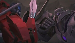 Optimus Prime battles Megatron.