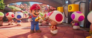 Mario giving a coin to a random Toad