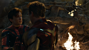 Iron Man reunites with Spider-Man, preparing to hug him.