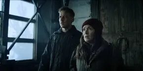 Joyce and Antonov listening to Yuri explain the history of his helicopter and its namesake.