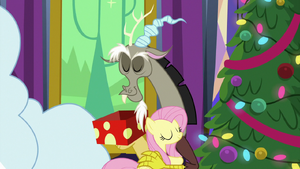 Discord and Fluttershy hug