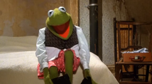 Kermit in his boxer shorts getting ready for a dinner with Miss Piggy in The Great Muppet Caper.