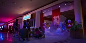 Lucas and his friends witnessing the glass shatter as El removes the creature from within her leg.