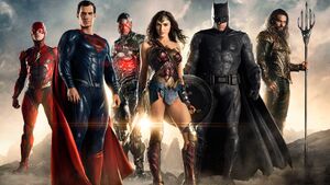 Promotional iamge of The Flash with his fellow Justice League teammates - Batman, Wonder Woman, Aquaman, Cyborg, and Superman.