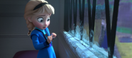 Elsa reacts to frost forming on the window ledge when she touches it