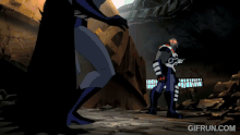 Batman dodges Darkseid's Omega Beam