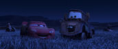 McQueen and Mater laughing while tractor tipping