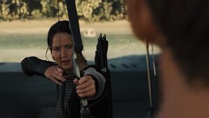 Catching Fire Katniss aims at Finnick