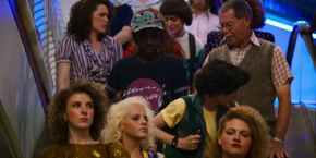 Lucas, Mike, and Will taking an escalator.