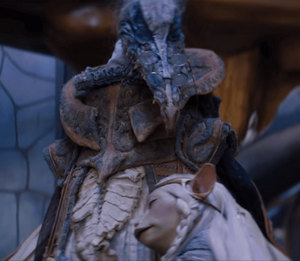 Brea hugging her idol SkekOk in gratitude, much to the Skeksis' awkward discomfort.